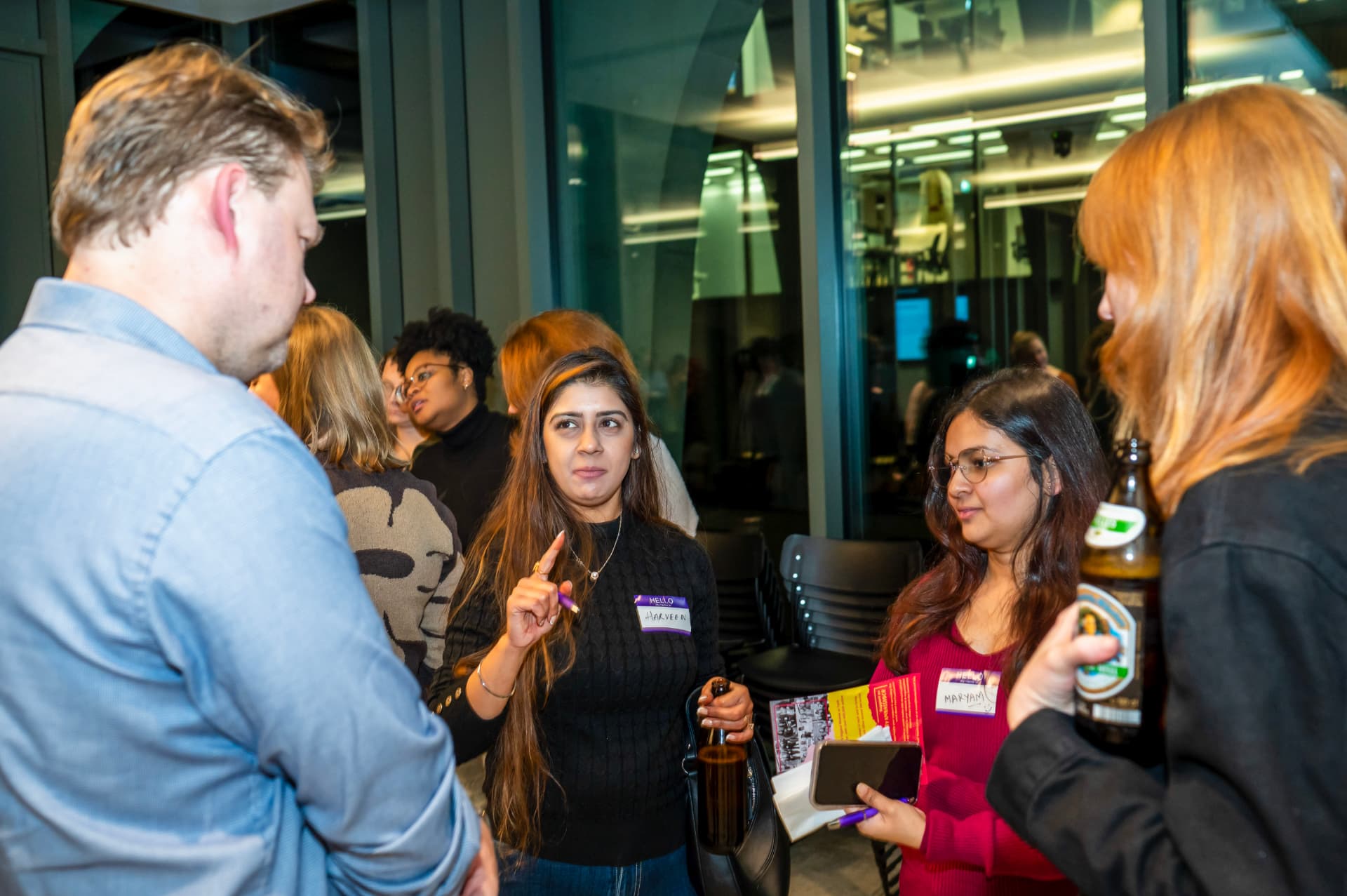 Attendees networking at a FemTechConf summit